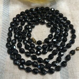 Vintage black glass, hand knotted beads 48”